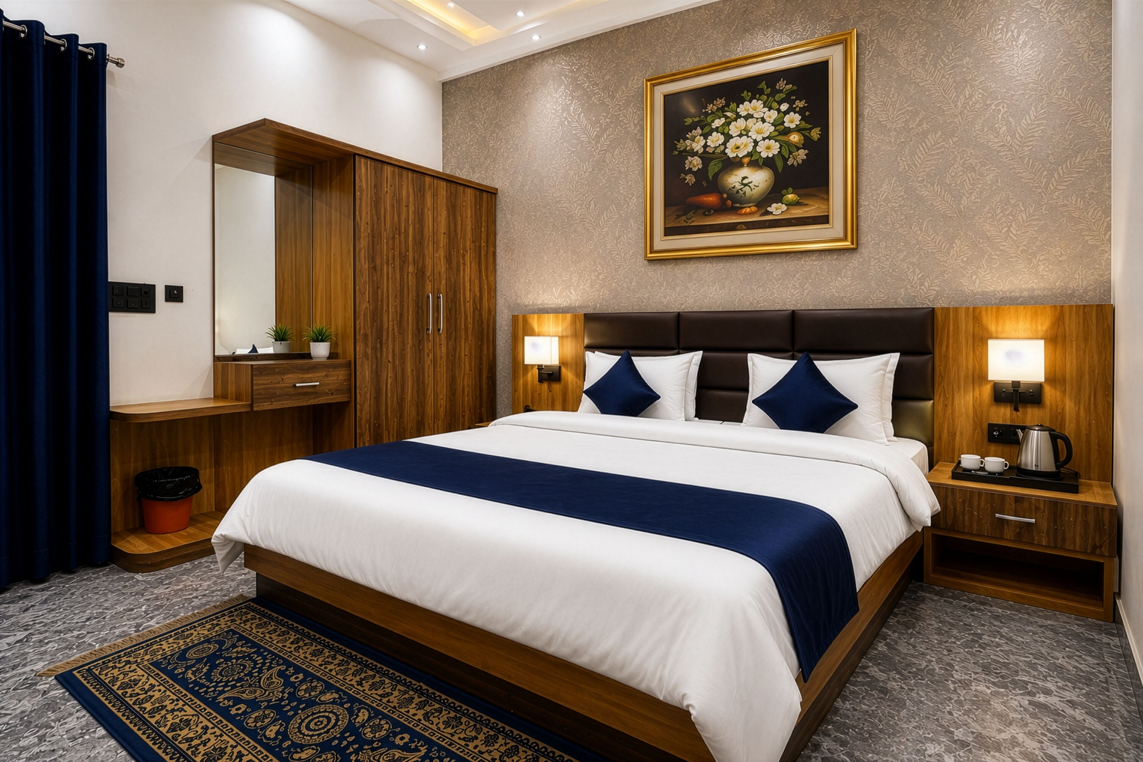Habitación de hotel con una cama grande, un armario de madera, una mesita de noche con lámpara y un cuadro en la pared.