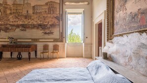 A room with a bed, a desk, a chair, and a large window. - Spectacular 18th-century Mansion with pool (Terni)