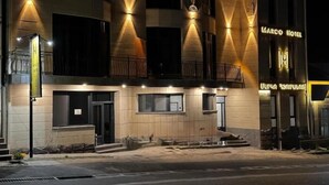 A hotel with a modern facade, multiple balconies, and a prominent entrance. - MARCO Hotel (Goris)