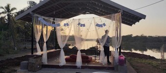 Cozy river Cauvery farmstay near Mysore. Cozy riverside views, yoga, and nature.