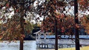 A lakeside gazebo with a wooden deck and a view of the water. - ADORABLE AND SPACIOUS 2 BR, 2 BA CONDO ... ON REHOBOTH AVE - 18 THE ARK (Rehoboth Beach)