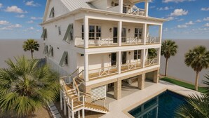 Ein mehrstöckiges Strandhaus mit Balkonen, einem Pool und Palmen.