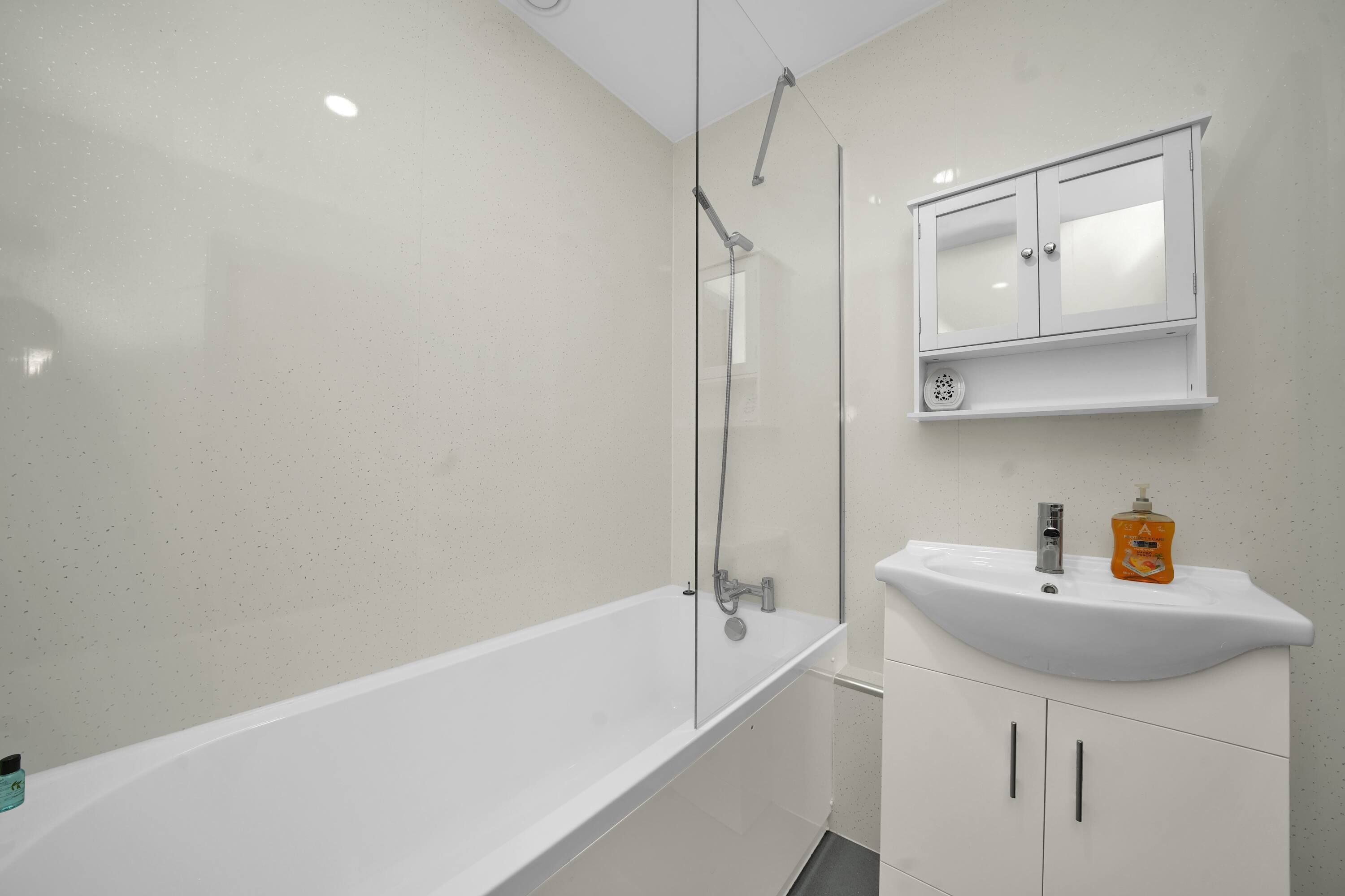 Shower, hair dryer, towels, shampoo