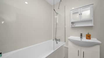 Shower, hair dryer, towels, shampoo