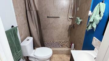 Shower, towels, soap, toilet paper