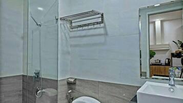 Shower, hair dryer, towels, toilet paper