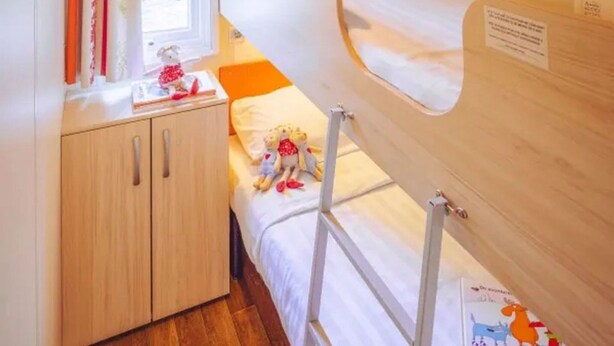 A child's room with bunk beds, a wooden wardrobe, and a window with curtains. - Coastal Family Escape for Summers (Brtonigla)