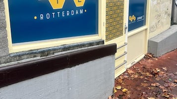 A building with a sign reading 'The Hive Rotterdam.'