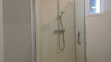 Shower, hair dryer, towels, soap