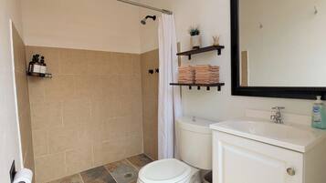 Bidet, towels, soap, toilet paper