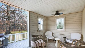 A covered porch with a grill, wicker chairs, and a ceiling fan. - Charming & Peaceful Catskills Getaway 2hr from NYC (Mountain Dale)
