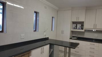 Full-sized fridge, microwave, stovetop