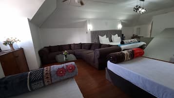 Deluxe Quadruple Room, Courtyard View | Desk, laptop workspace, iron/ironing board, free WiFi