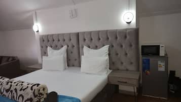 Deluxe Quadruple Room, Courtyard View | Desk, laptop workspace, iron/ironing board, free WiFi