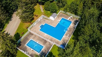 Seasonal outdoor pool, open 10:00 AM to 7:00 PM, lifeguards on site