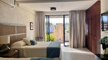 Deluxe Double Room, Patio | In-room safe, desk, laptop workspace, blackout curtains
