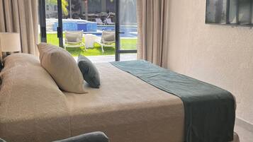Classic Double Room, Patio, Pool View | In-room safe, desk, laptop workspace, blackout curtains