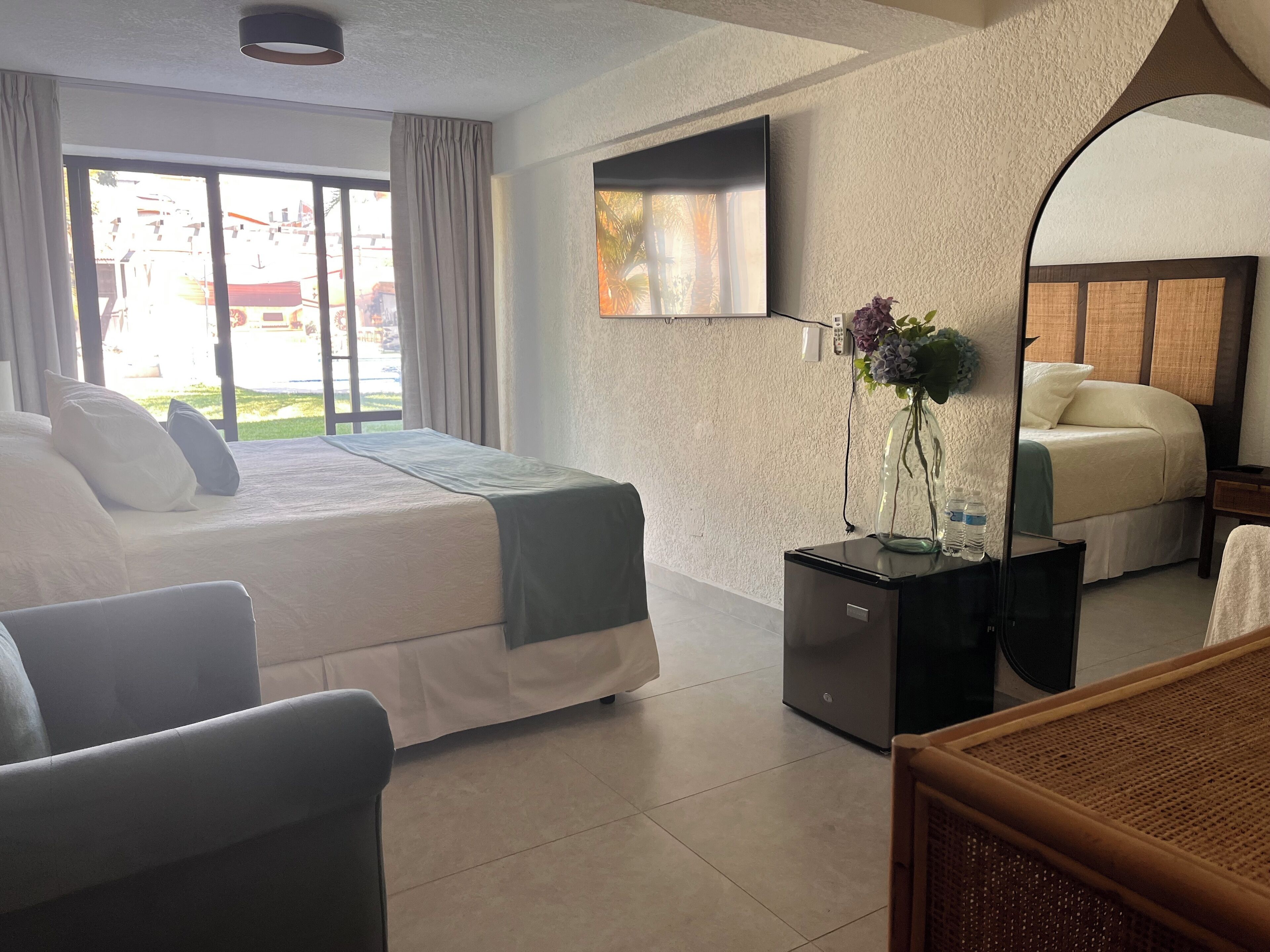 Classic Double Room, Patio, Pool View | In-room safe, desk, laptop workspace, blackout curtains