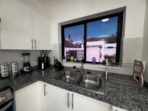 Fridge, microwave, oven, stovetop - VILLA GREEN PARADISE GATED COMMUNITY SECURITY 24 HOURS  (puerto plata)