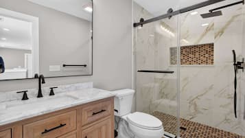 Shower, hair dryer, towels, shampoo