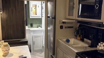 Fridge, microwave, stovetop, coffee/tea maker