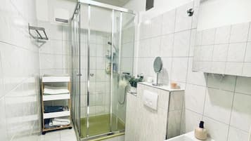 Shower, hair dryer, towels, soap
