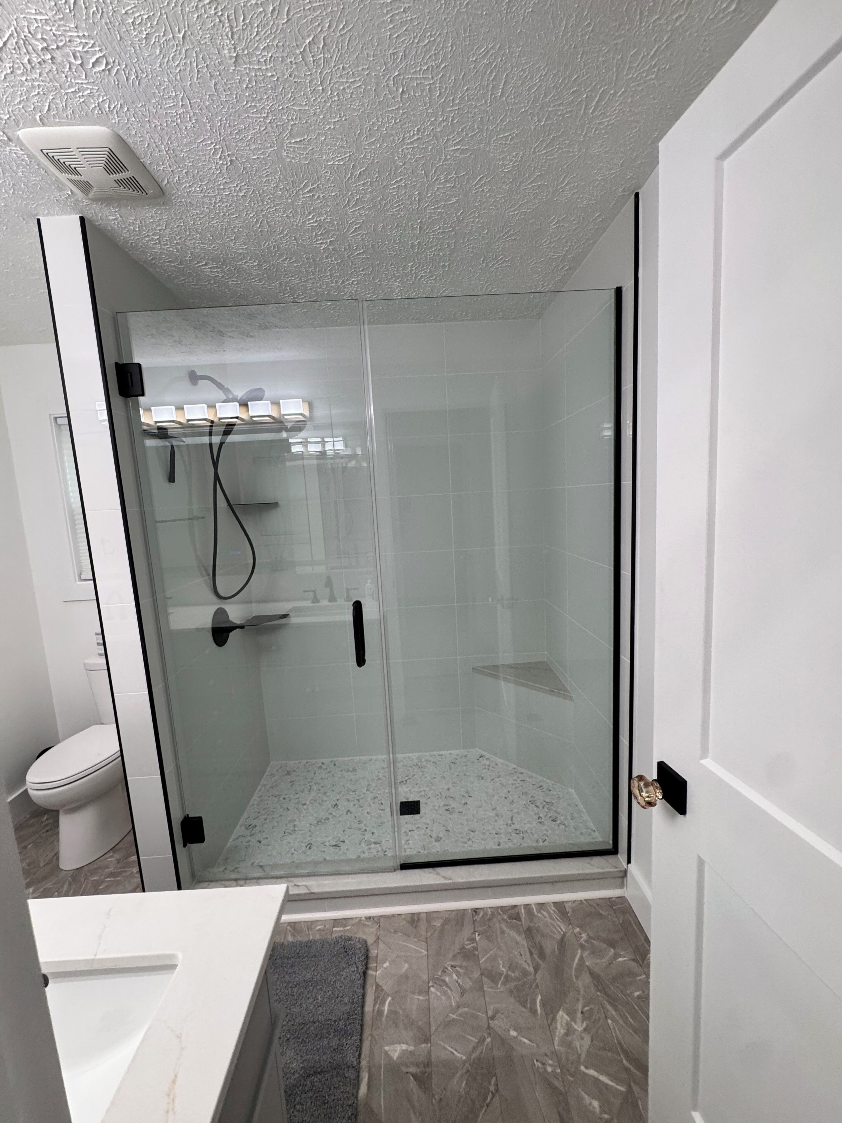 Shower, hair dryer, towels, toilet paper