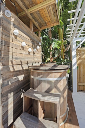 A wooden outdoor structure with a barrel, steps, and hanging lights. - 5 Min to Atlantic Ave & Beach - Pool + Sauna Retreat (Delray Beach)