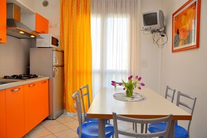 Apartment, 1 Bedroom, Balcony, Ocean View | Dining room - Renewed Flat in a Seafront Building With Pool (San Michele al Tagliamento)