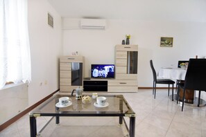 Apartamento, 1 quarto, para fumantes, varanda | Sala de estar
