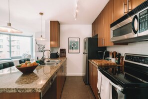 Fridge, microwave, oven, stovetop - FIFA World Cup Condo With Pool, Gym, and Hottub | Steps to BC Place | Sleeps 4 (Vancouver)