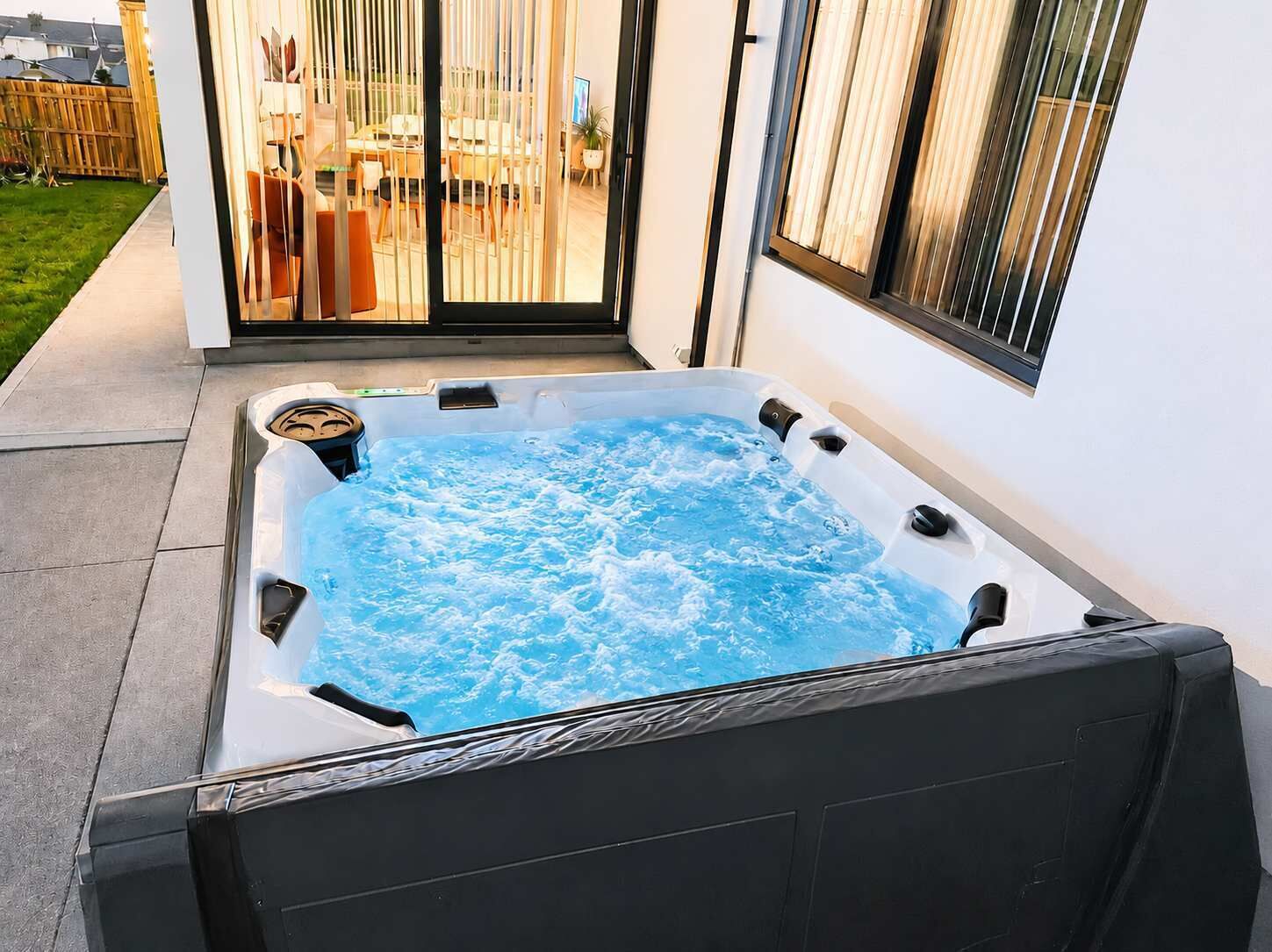 A hot tub with a clear view of the surrounding patio area.