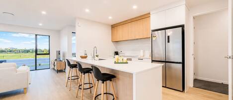 Coffee/tea maker, fridge, microwave, oven