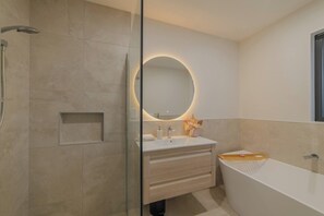 Shower, hair dryer, towels, shampoo