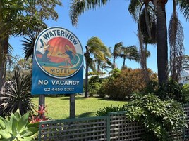 A sign for the Waterview Motel with a no vacancy notice.