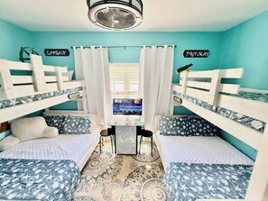 A room with bunk beds, a desk, and a computer. - 2602 Rookery 1 2 A Shiny Penny - Beach hot tub Pool (Gulf Shores)