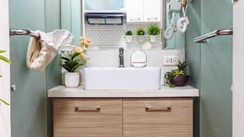 Bidet, towels, soap, toilet paper