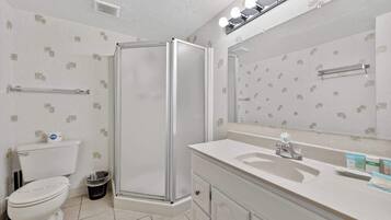 Shower, hair dryer, towels, shampoo