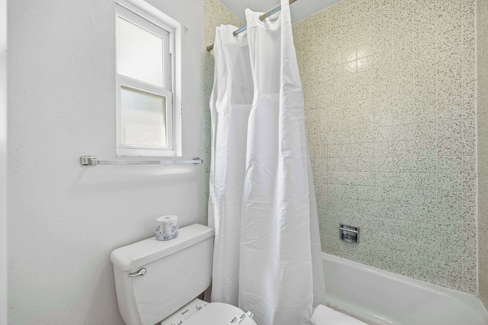 Shower, hair dryer, towels, shampoo