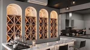 A modern kitchen with a wine storage unit, marble countertops, and a bar area. - Eco Boutique Satva Udaipur - Vegetarian with all Options (Udaipur)
