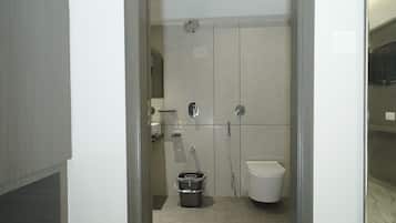 Basic Room, 1 King Bed, City View | Bathroom | Shower, towels, soap, shampoo