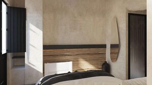 A modern hotel room with a bed, a wooden headboard, a black wardrobe, and a large window. - Anemos Central Fira (Santorini)