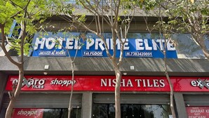 A hotel named 'Hotel Prime Elite' with a sign indicating '1st Floor' and a contact number. - Hotel Prime Elite (Ahmedabad)