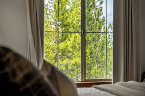 A room with a large window, a bed, and curtains. - NEW! Ski-In/Out Granby Ranch・Sleeps 16 ・Arcade (Granby)