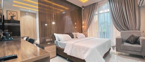 Deluxe Room, Balcony, City View | Desk, laptop workspace, blackout drapes, soundproofing