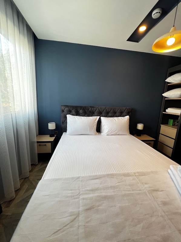 Deluxe Apartment, 1 Queen Bed with Sofa bed, Non Smoking, City View | Desk, laptop workspace, blackout curtains, iron/ironing board