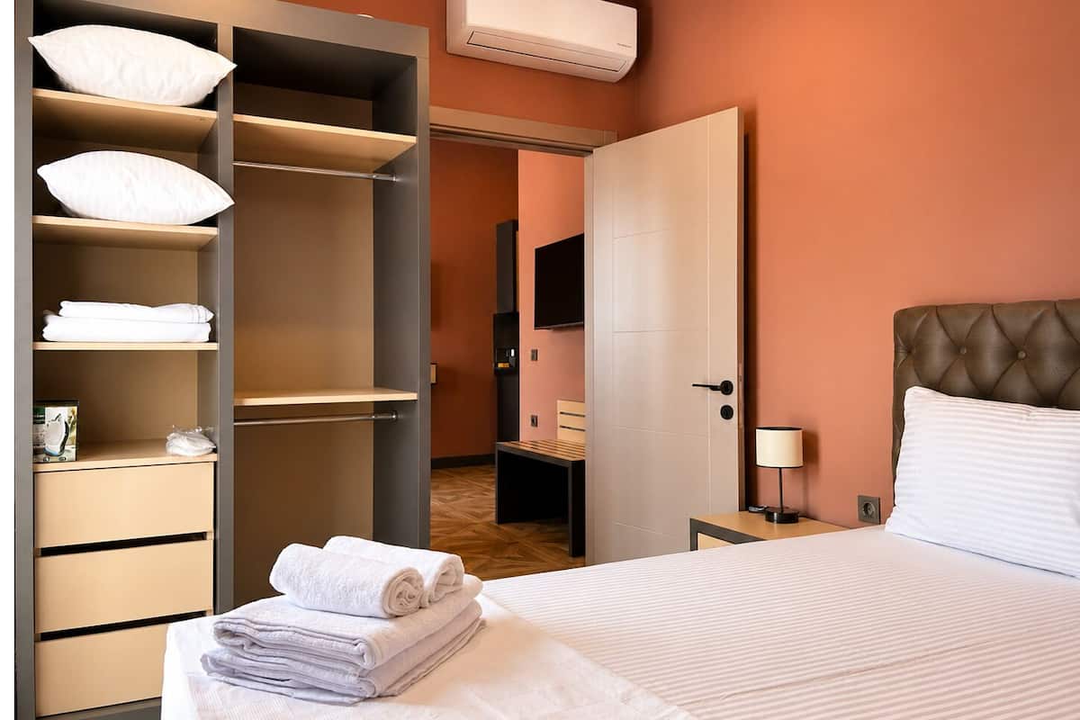 Deluxe Penthouse, 1 Queen Bed with Sofa bed, Non Smoking, City View | Desk, laptop workspace, blackout drapes, iron/ironing board