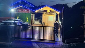 A building with a sign reading 'HAZY HILL' and a neon sign above the entrance. - Hazy hill  (Mussoorie)