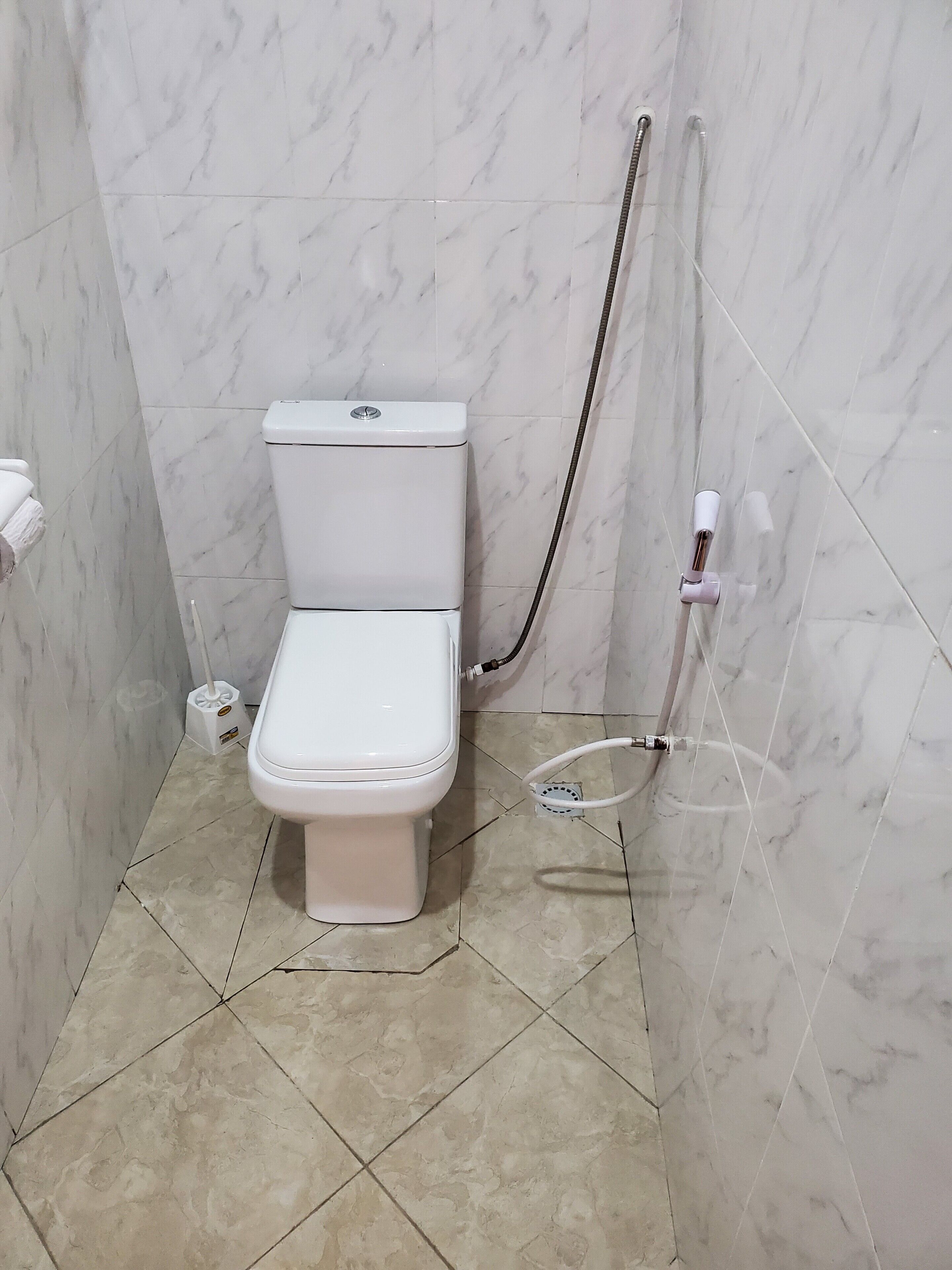 Shower, slippers, towels, soap