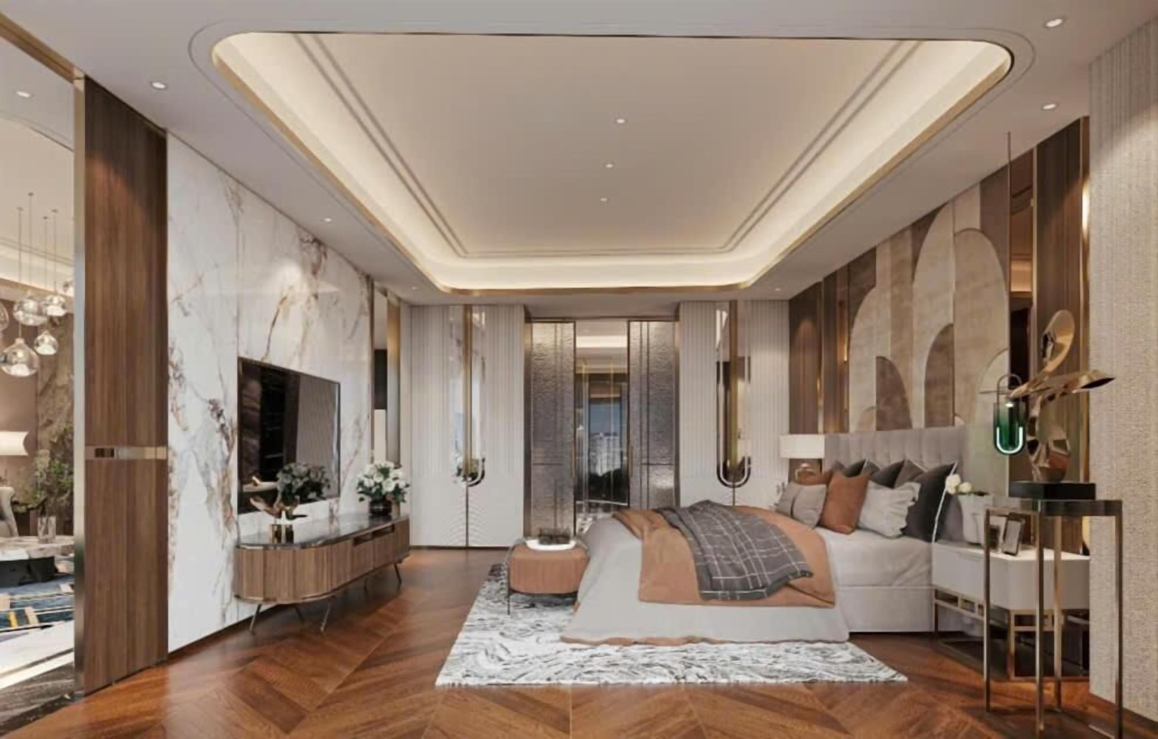 A modern bedroom with a large bed, a vanity, a mirror, and a sofa.